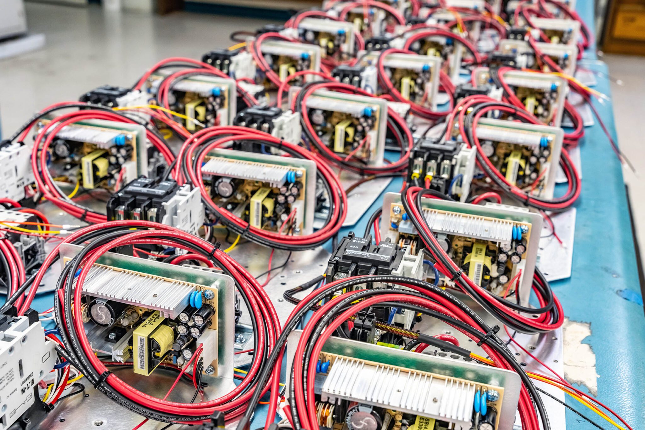 Rows of electronic circuit boards with wires.