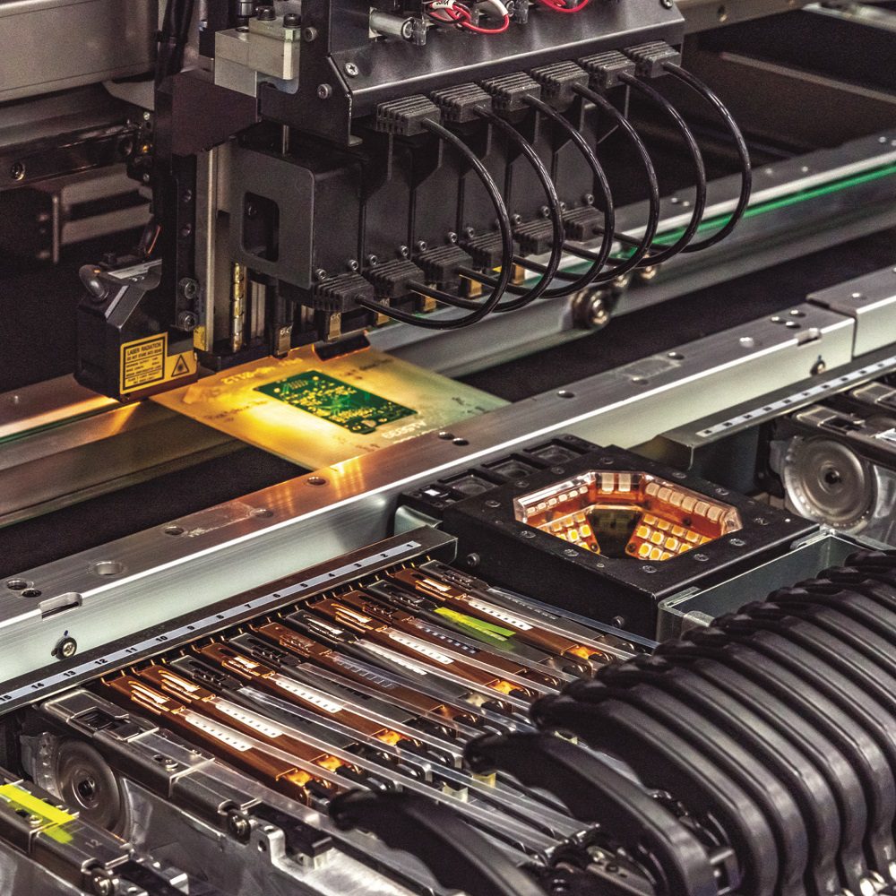 Automated circuit board manufacturing machinery in operation.