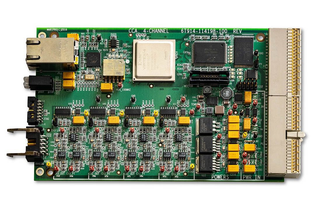 Electronic circuit board with various components.