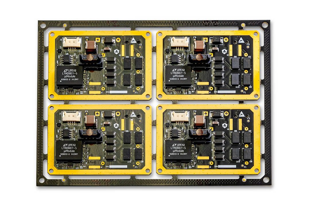 Four electronic circuit boards in a panel.