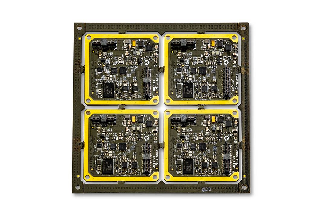 Four yellow-bordered electronic circuit boards.