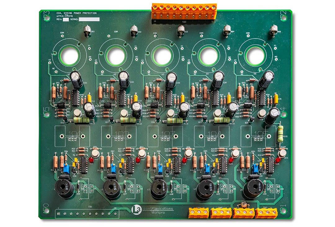 Electronic circuit board with various components.