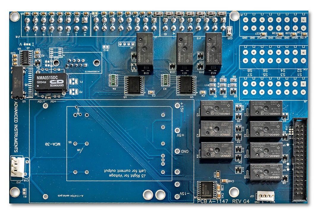 Blue electronic circuit board with relays and connectors.