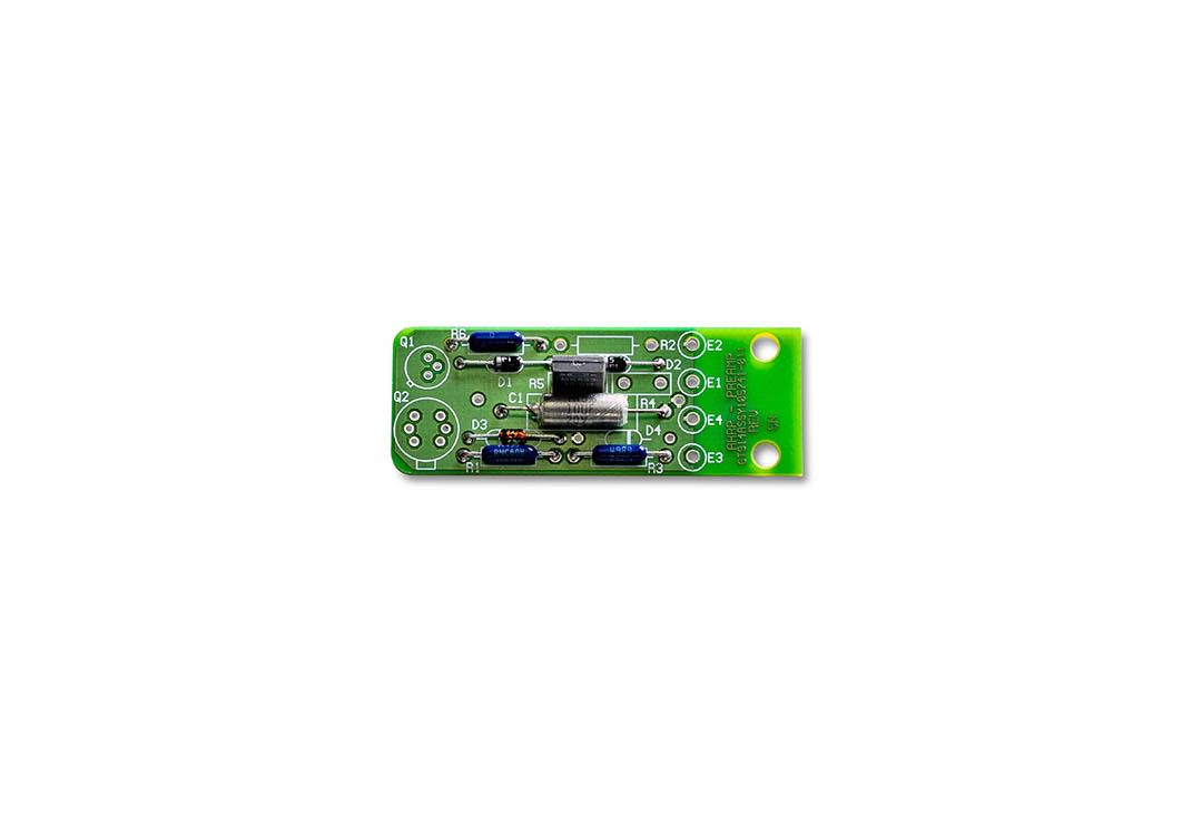 Green electronic circuit board with components.