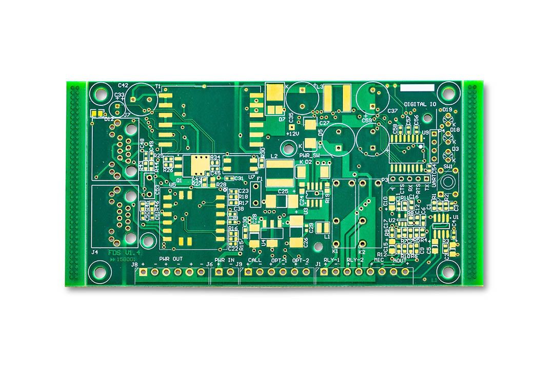 Green electronic circuit board with various components.