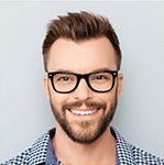 Smiling man with glasses and short beard
