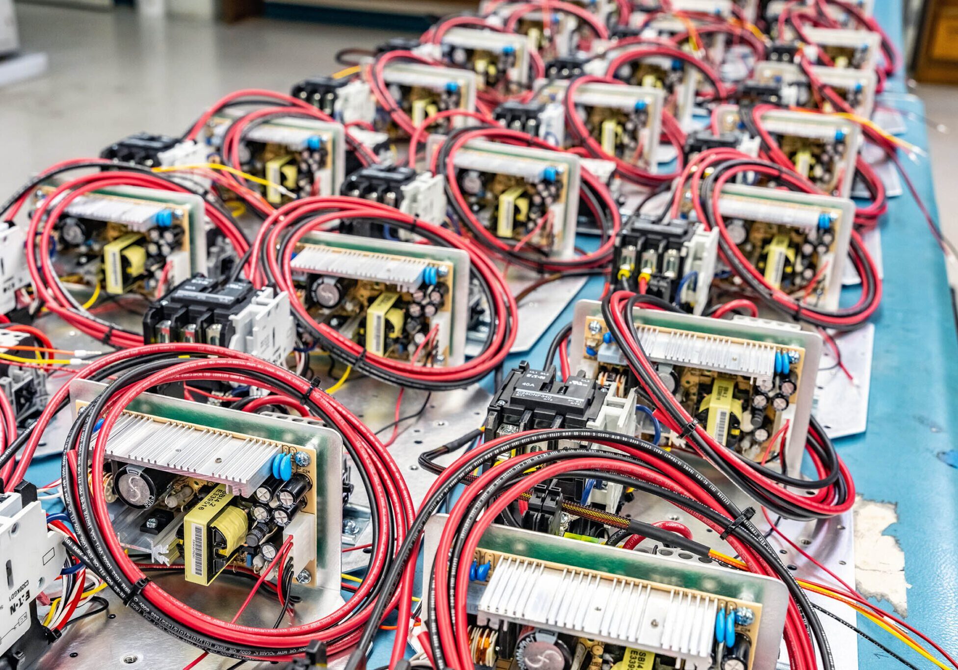 Rows of electronic circuit boards with wires.